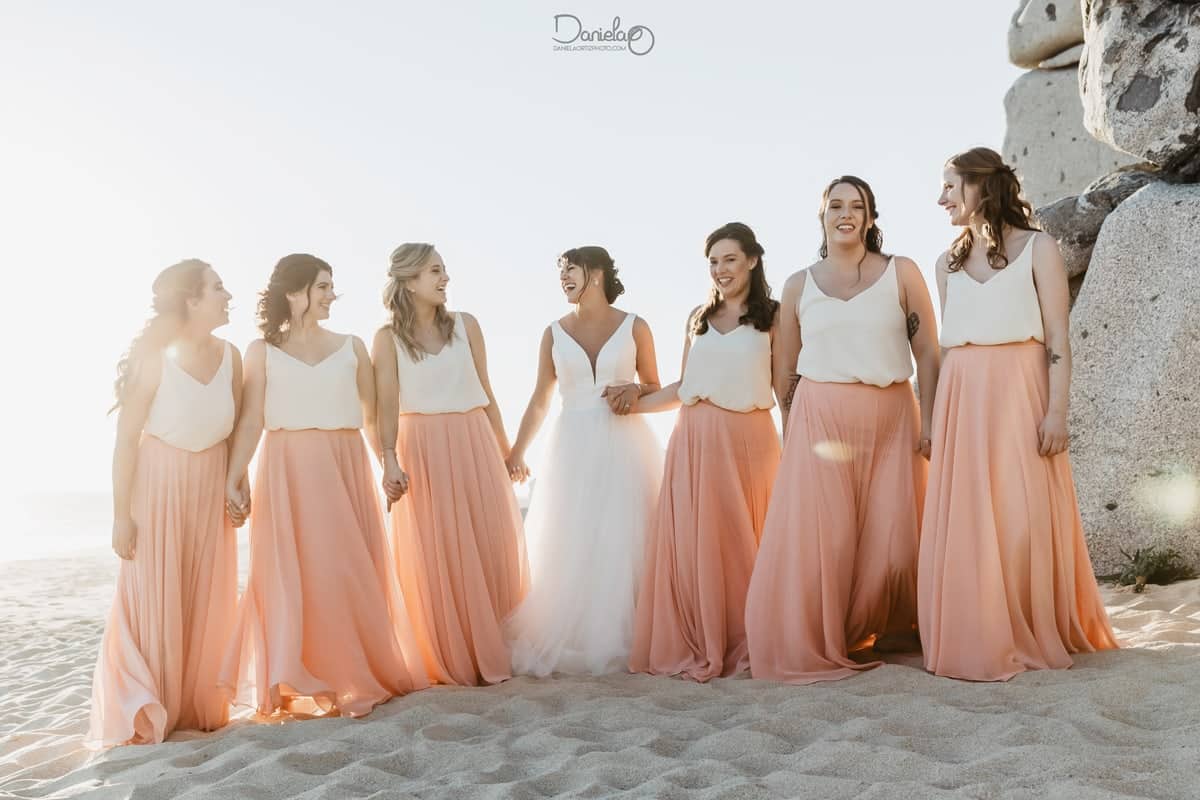 Bridal party at a Pedregal beach cabo wedding in Cabo San Lucas, granite boulders and Pacific behind
