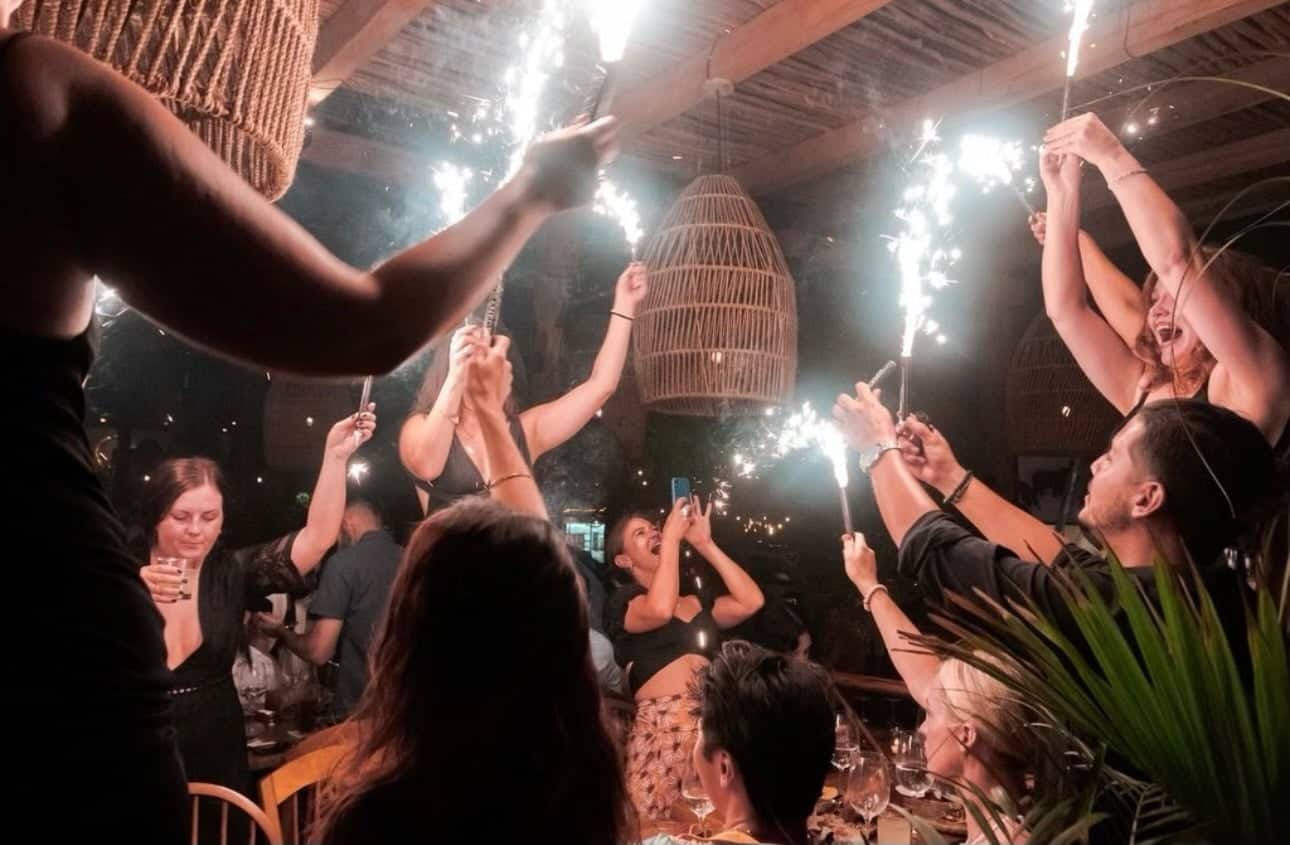 Guests raising sparklers at a Casa Mareva luxury cabo wedding celebration in a private villa